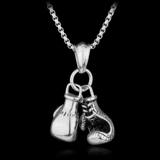 Siver boxing gloves necklace pendant on dark bakground