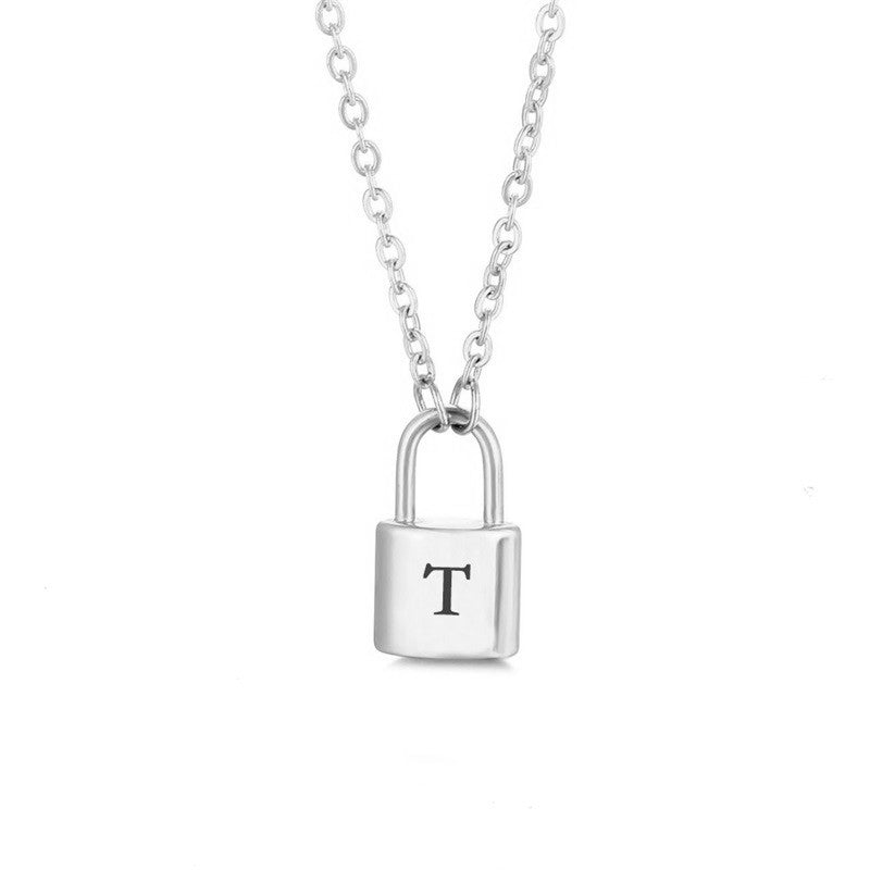 Silver initial lock necklace with letter T pendant on a minimal clean background