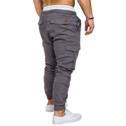 Back view of slim fir cargo joggers for men in gray color, featuring elastic cuffs and cargo pockets.
