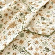Close-up of breathable cotton gauze floral fabric texture
