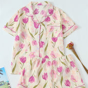 Women’s tulip floral bubble crepe pajama set featuring a short sleeve button-up top and matching shorts.
