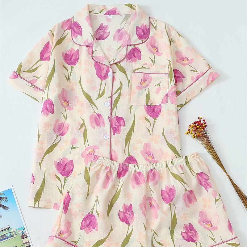 Women’s tulip floral bubble crepe pajama set featuring a short sleeve button-up top and matching shorts.
