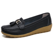 Women’s black genuine leather loafers with elegant tassel detail and comfortable fit.
