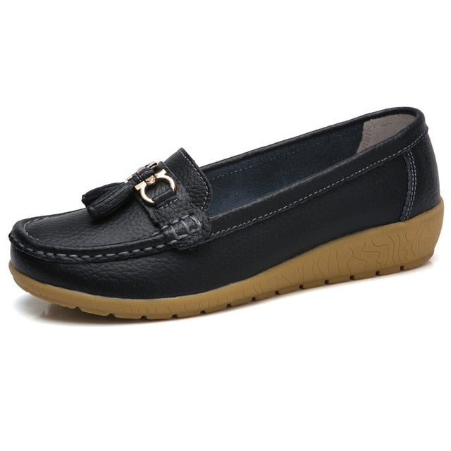 Women’s black genuine leather loafers with elegant tassel detail and comfortable fit.
