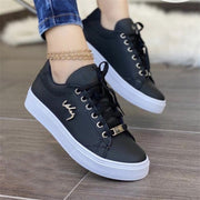 Women’s black casual canvas sneakers with lightweight lace-up design
