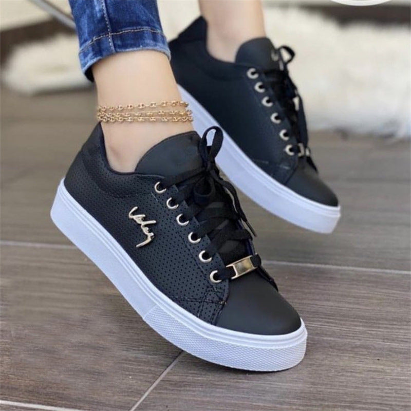 Women’s black casual canvas sneakers with lightweight lace-up design
