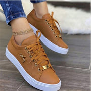Women’s brown casual canvas sneakers with lightweight lace-up design
