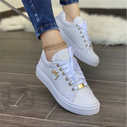 Women’s white casual canvas sneakers with lightweight lace-up design
