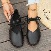 Top view of women’s black casual lace-up sneakers designed for lightweight comfort, walking, and everyday casual style.
