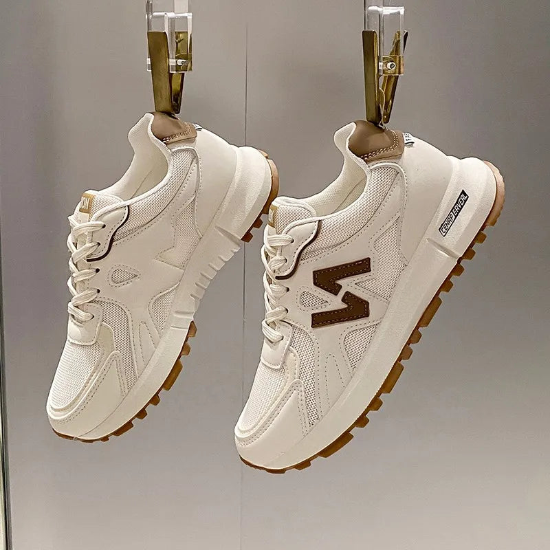 Women’s chocolate lightweight mesh running sneakers with breathable upper and cushioned sole.
