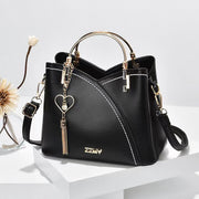 Black women's color block handbag with elegant design and crossbody shoulder strap
