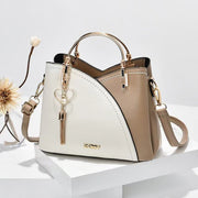 Khaki and white women's color block shoulder bag with gold hardware and crossbody strap
