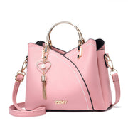 Pink women's color block shoulder bag with large capacity and adjustable crossbody strap
