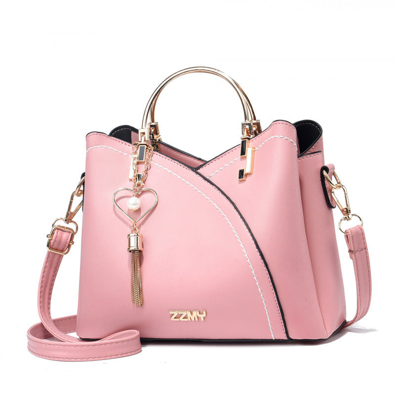 Pink women's color block shoulder bag with large capacity and adjustable crossbody strap
