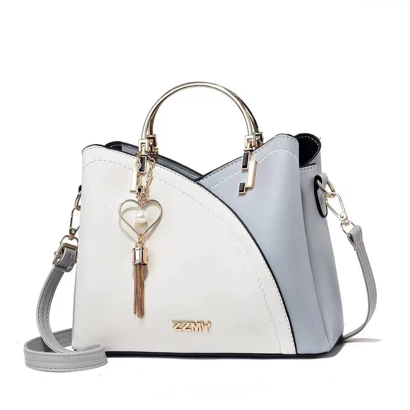 Sky blue and white women's color block handbag with gold-tone hardware and crossbody strap
