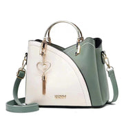White and green women's color block shoulder bag with spacious interior and stylish design
