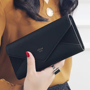 Black women's designer envelope clutch wallet for everyday and evening use
