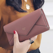 Light brown women's envelope clutch wallet with spacious card and cash storage
