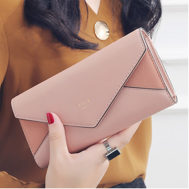 Women's designer envelope clutch wallet in pink with elegant slim design for everyday use
