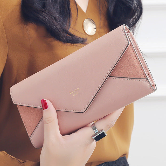 Pink women's designer envelope clutch wallet for shopping, travel, and everyday fashion

