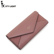 Pink women's envelope clutch wallet with minimalist designer style
