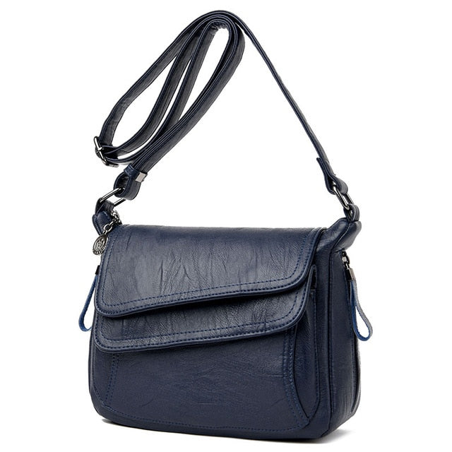 Women's genuine leather crossbody bag in blue color
