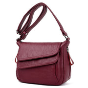 Women's genuine leather crossbody bag in red wine color
