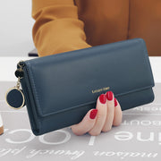 Blue women's long wallet made from PU leather for everyday use and travel
