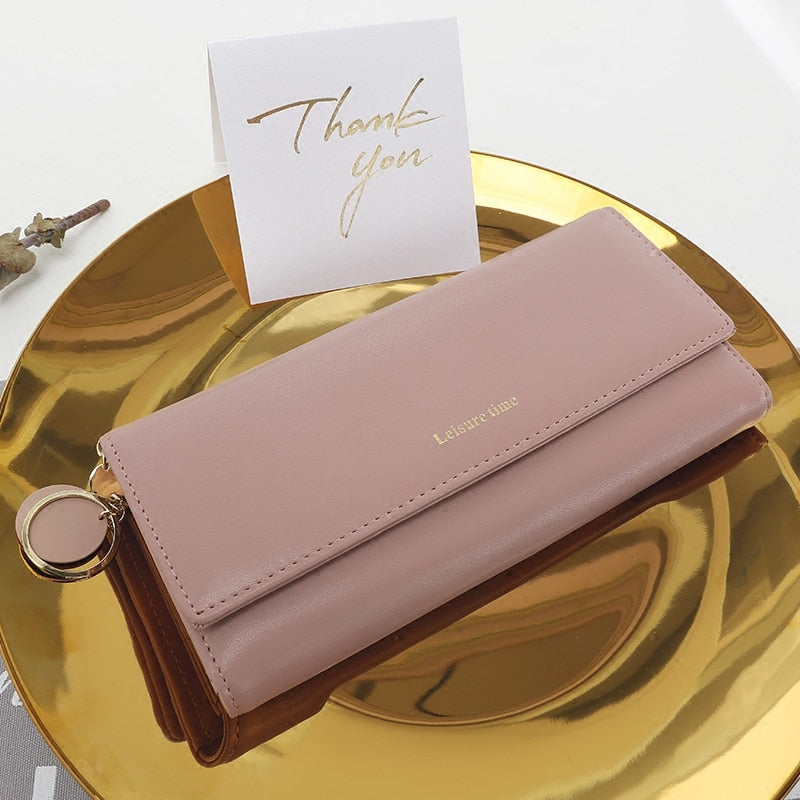Pink women's long PU leather wallet with stylish slim design and multiple compartments
