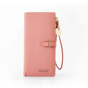 Pink women's long wristlet wallet with spacious interior and wrist strap.
