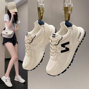 Woman wearing lightweight mesh running sneakers for casual walking and everyday comfort.
