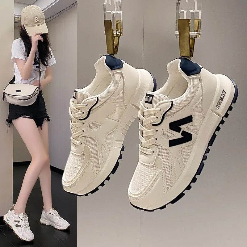Woman wearing lightweight mesh running sneakers for casual walking and everyday comfort.

