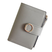 Gray women's compact PU leather wallet with snap closure.
