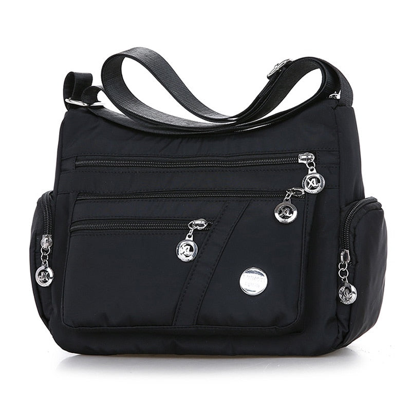 Women’s black nylon crossbody messenger bag with multiple storage compartments
