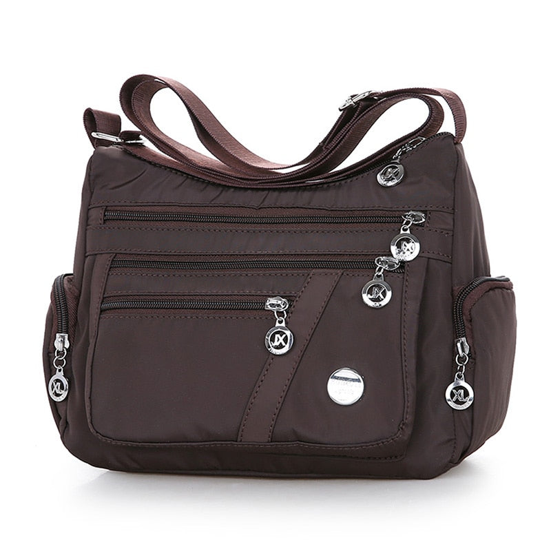 Women’s brown nylon crossbody messenger bag with adjustable shoulder strap
