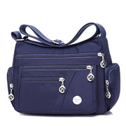 Women’s dark blue nylon messenger shoulder bag with multiple pockets
