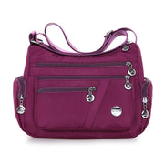 Women’s purple nylon shoulder messenger bag with multiple compartments
