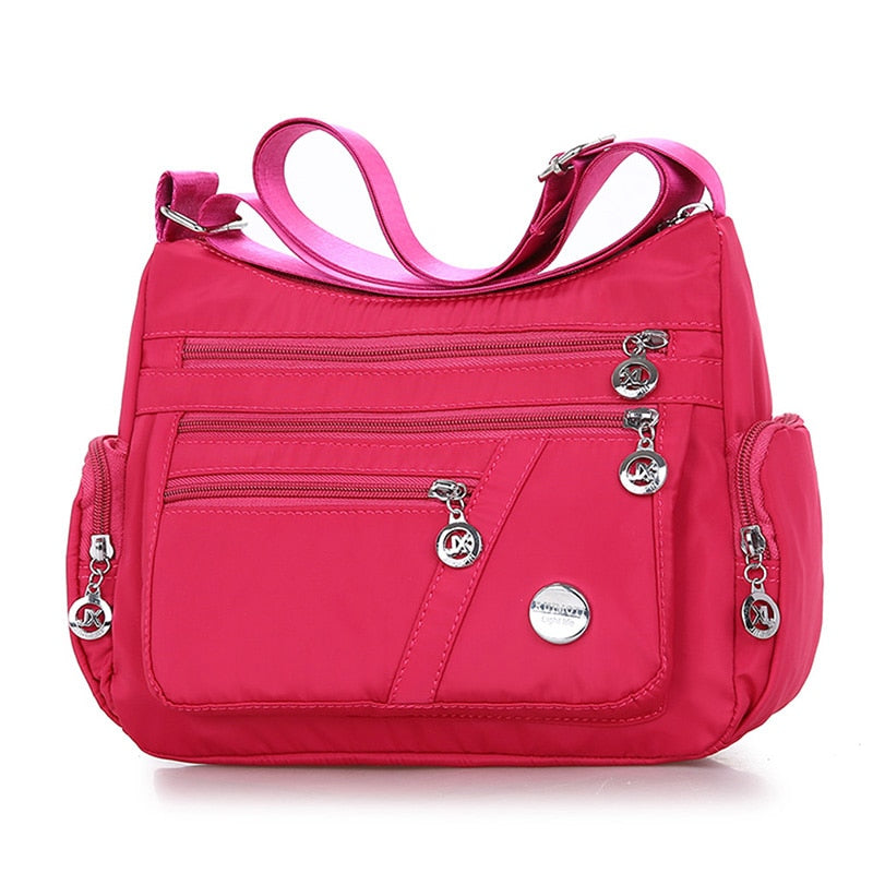 Women’s rose red nylon crossbody messenger bag with zippered pockets
