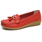 Women’s red genuine leather slip-on loafers with durable rubber outsole.
