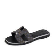 Women’s gray rhinestone slide sandals with sparkling crystal embellishments

