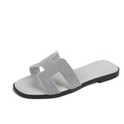 Women’s silver rhinestone slide sandals with sparkling crystal embellishments
