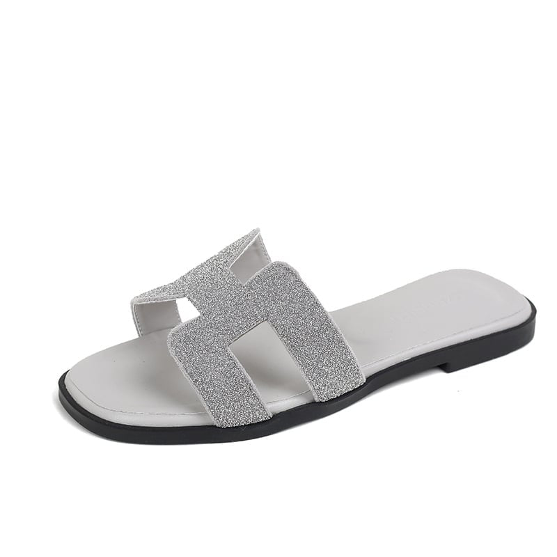 Women’s silver rhinestone slide sandals with sparkling crystal embellishments
