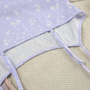 Adjustable spaghetti strap detail on a women's printed pajama camisole.
