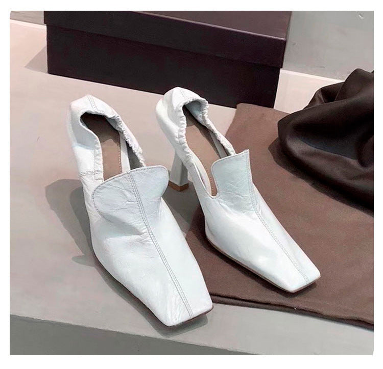 Women’s white square toe mule heels with elegant slip-on design
