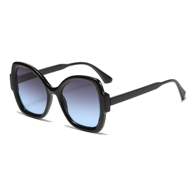 Women’s oversized UV400 sunglasses featuring a black frame and blue gradient lenses.
