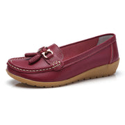 Women’s wine red genuine leather loafers featuring a classic slip-on design.
