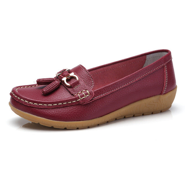 Women’s wine red genuine leather loafers featuring a classic slip-on design.
