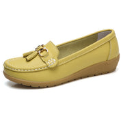 Women’s yellow genuine leather slip-on loafers with soft cushioned comfort.
