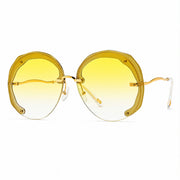 Yellow yellow rimless oversized cut lens sunglasses with translucent yellow frame accents and gold temples.
